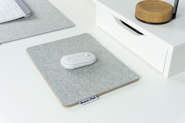 Wool and Cork mousepad - Pebble Grey from angle, with mouse