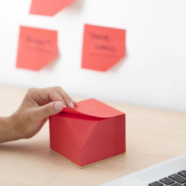 Pink sticky notes block by Block Design, showing a sheet being peeled away