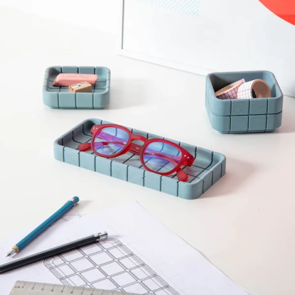 Steel blue concrete desk tray shown with glasses inside