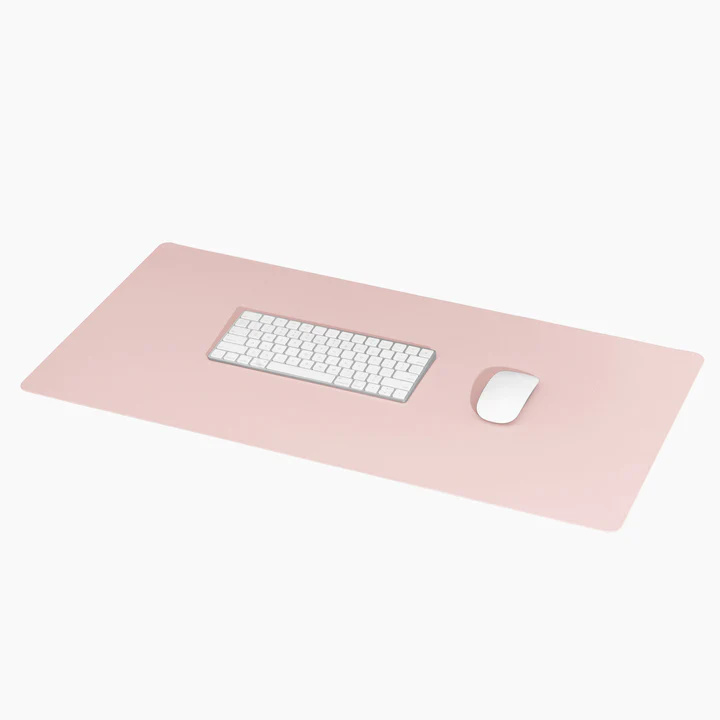 Poketo vegan leather desk mat pink with white keyboard and mouse on top